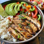 ['Close-up view of a creamy chicken fajita bowl with colorful vegetables and rice.', 'Side view of a delicious creamy chicken fajita bowl featuring sliced chicken and bell peppers.', 'Juicy creamy chicken fajita bowl with onions, peppers, and toppings like cilantro and lime.', 'Vibrant bowl of creamy chicken fajitas topped with avocado and served with rice.']