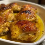 ['Close-up view of glazed honey baked chicken with a juicy texture.', 'Side view of succulent honey baked chicken showcasing a golden glaze.', 'Detailed shot of tender chicken breasts coated in a honey mustard glaze.', 'Close-up image of mouth-watering honey baked chicken with herbs.']