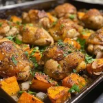 A close-up side view of a Chicken and Sweet Potato Casserole, highlighting the juicy chicken pieces and vibrant orange sweet potatoes.
