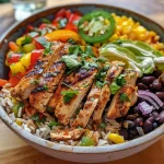 Close-up view of a Chicken Fajita Bowl featuring colorful bell peppers, chicken, and rice.